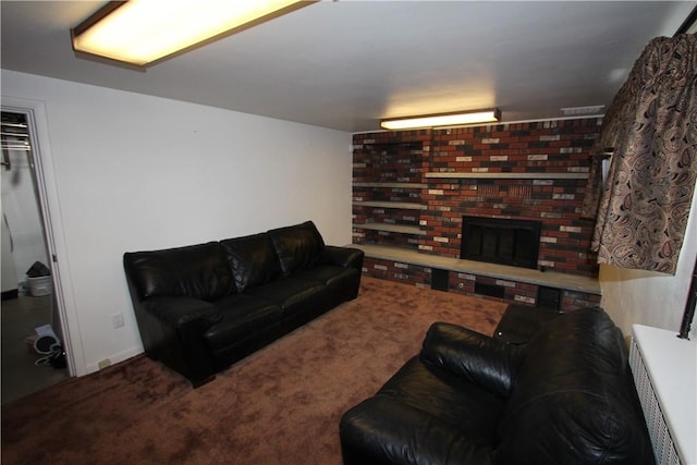 carpeted living room with a fireplace