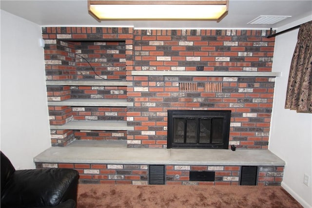 interior details with a fireplace and carpet