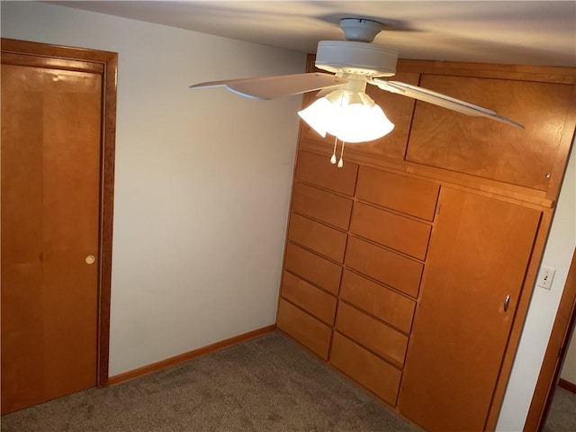 unfurnished bedroom with carpet flooring and ceiling fan