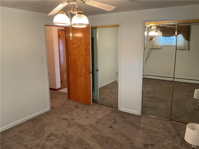 unfurnished bedroom with ceiling fan, a baseboard radiator, and dark colored carpet