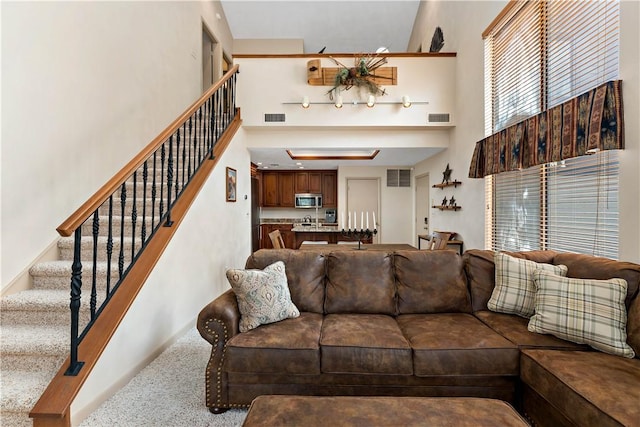 M1 Sunridge Rd, Seven Springs Resort, PA 15622 - living area featuring a towering ceiling and stairs