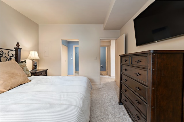 bedroom with light colored carpet