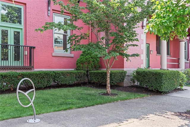 view of side of home featuring a yard