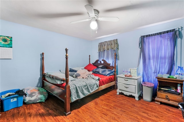 bedroom featuring hardwood / wood-style flooring and ceiling fan