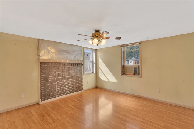 empty room with light hardwood / wood-style floors and ceiling fan