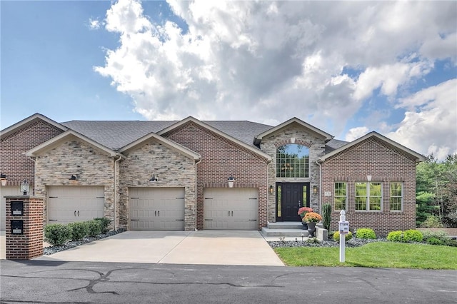 view of front of house featuring a shingled roof, concrete driveway, brick siding, and an attached garage