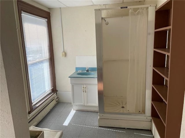 interior space with vanity and tile patterned floors