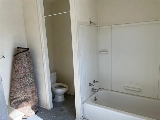 bathroom featuring bathing tub / shower combination and toilet