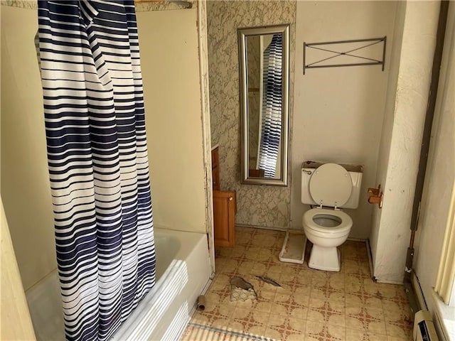 bathroom with shower / bath combo with shower curtain, toilet, and tile patterned floors