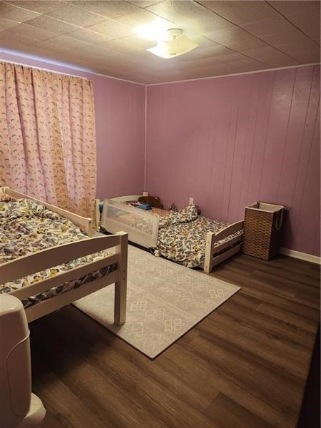 bedroom with hardwood / wood-style floors