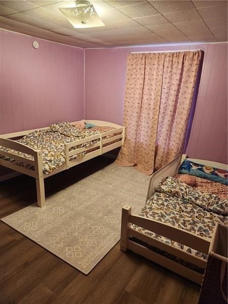 bedroom featuring wood-type flooring