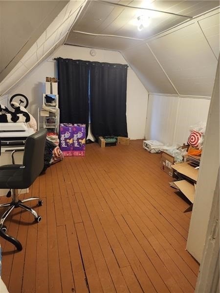 interior space featuring vaulted ceiling and hardwood / wood-style floors