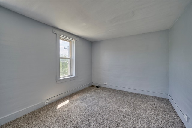 spare room featuring carpet floors