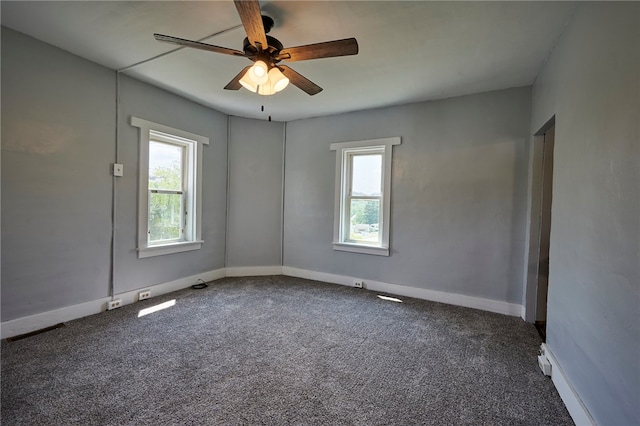 empty room with carpet floors and ceiling fan