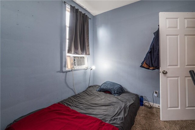 carpeted bedroom featuring cooling unit