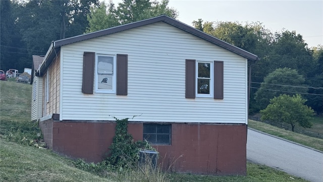 view of property exterior with central AC