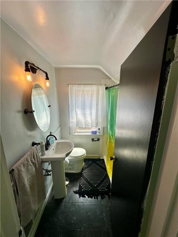 bathroom featuring toilet