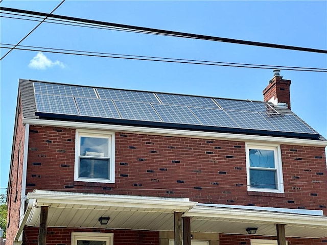 view of home's exterior with solar panels