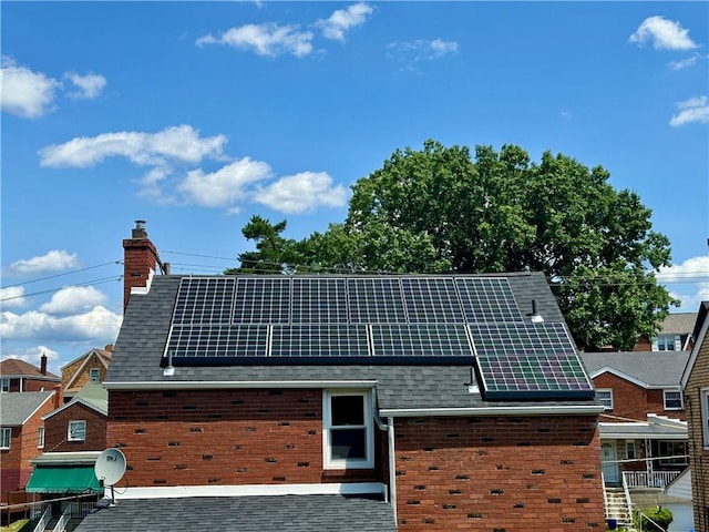 view of front of property with solar panels