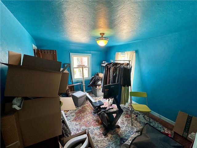 miscellaneous room featuring a textured ceiling