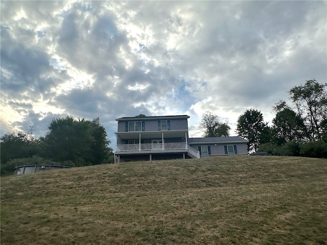 rear view of house with a yard