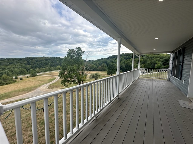 wooden deck with a yard