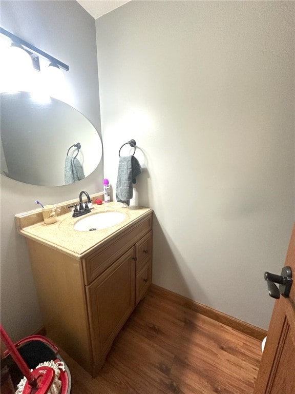 bathroom featuring vanity and wood-type flooring