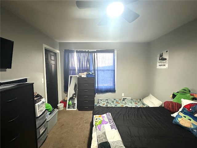 carpeted bedroom featuring ceiling fan