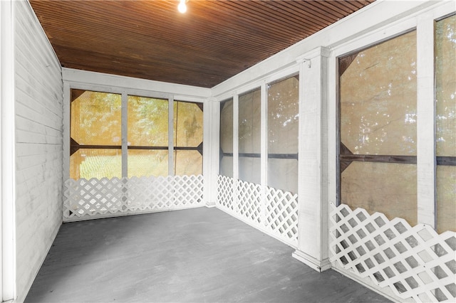 unfurnished sunroom featuring wooden ceiling