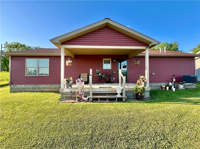 view of front of house with a deck and a front yard