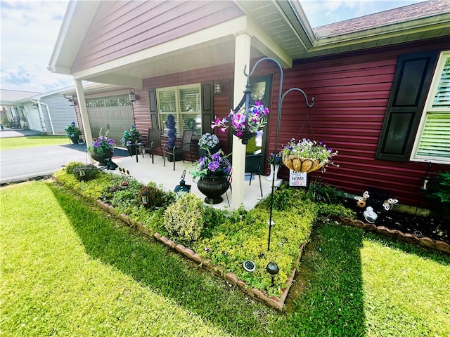 view of home's exterior with a yard and a garage