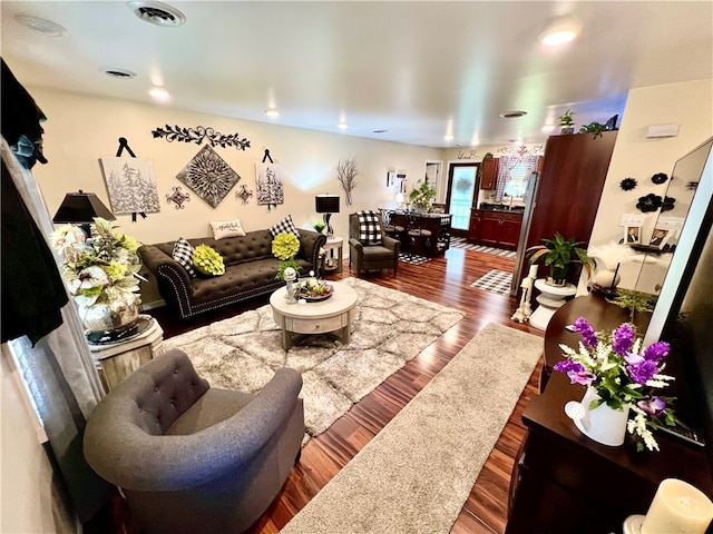 living room with dark hardwood / wood-style floors