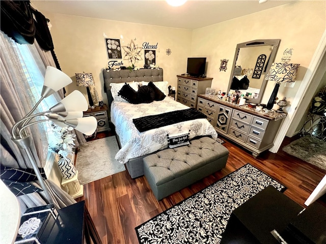 bedroom featuring dark hardwood / wood-style floors