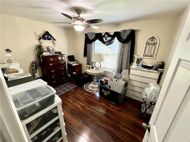 bedroom with dark wood-type flooring and ceiling fan