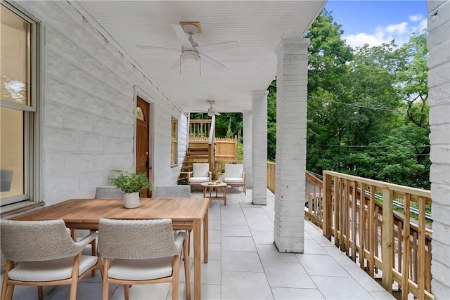 view of patio / terrace with ceiling fan and outdoor dining space