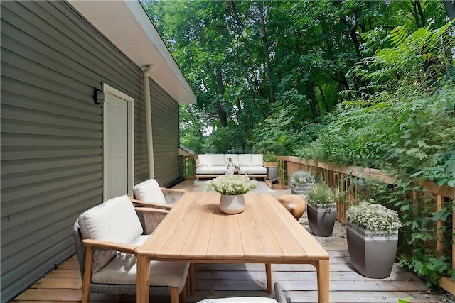 wooden terrace featuring an outdoor hangout area