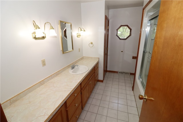 bathroom with vanity and tile patterned floors