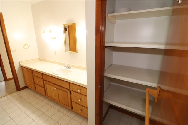 bathroom with tile patterned flooring and vanity