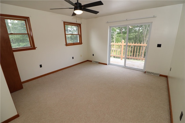 empty room featuring carpet and ceiling fan