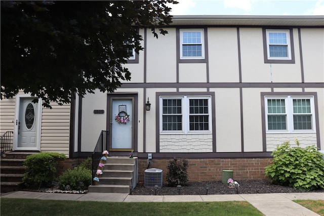 view of front of house featuring cooling unit