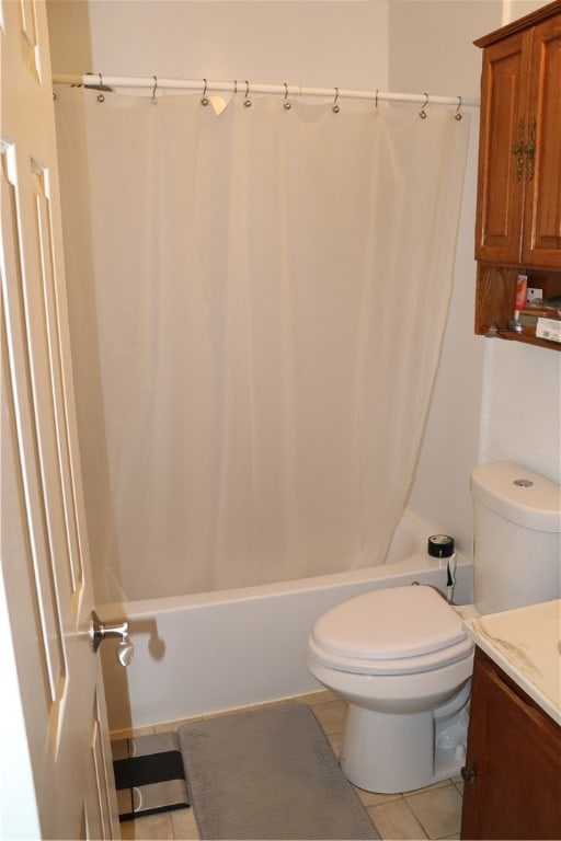 full bathroom featuring vanity, shower / tub combo, toilet, and tile patterned floors