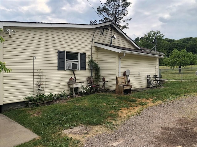 view of property exterior with a yard