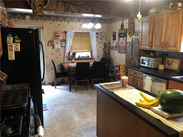 kitchen featuring dishwasher and pendant lighting