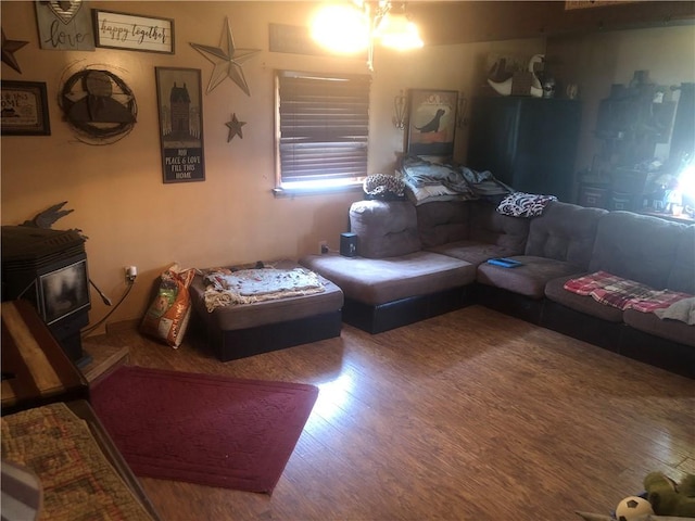 living room featuring hardwood / wood-style floors and a wood stove