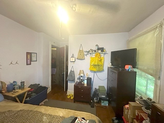 bedroom featuring dark wood-type flooring