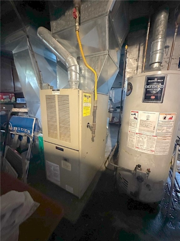 utility room featuring gas water heater and heating unit