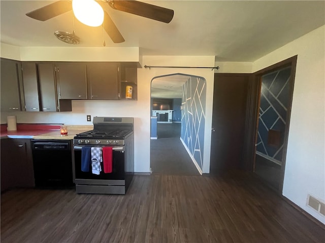 kitchen featuring dark brown cabinets, ceiling fan, dark hardwood / wood-style floors, black dishwasher, and stainless steel gas range