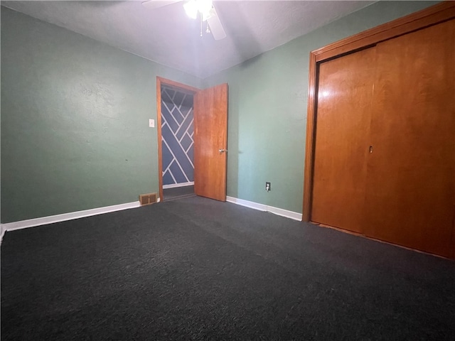 unfurnished bedroom with carpet, ceiling fan, and a closet