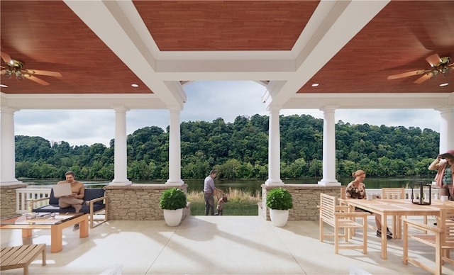 view of patio featuring a water view and ceiling fan