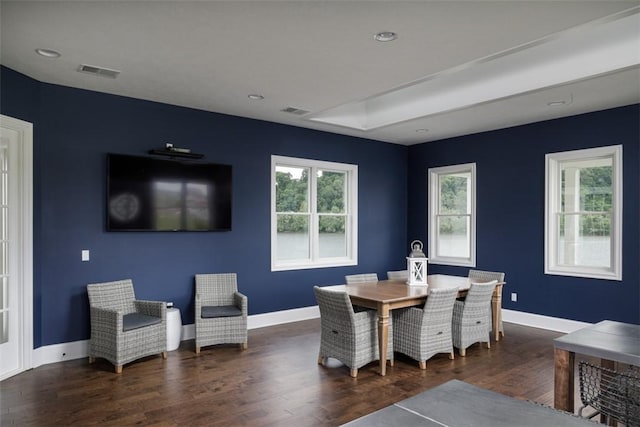 dining room with dark hardwood / wood-style flooring